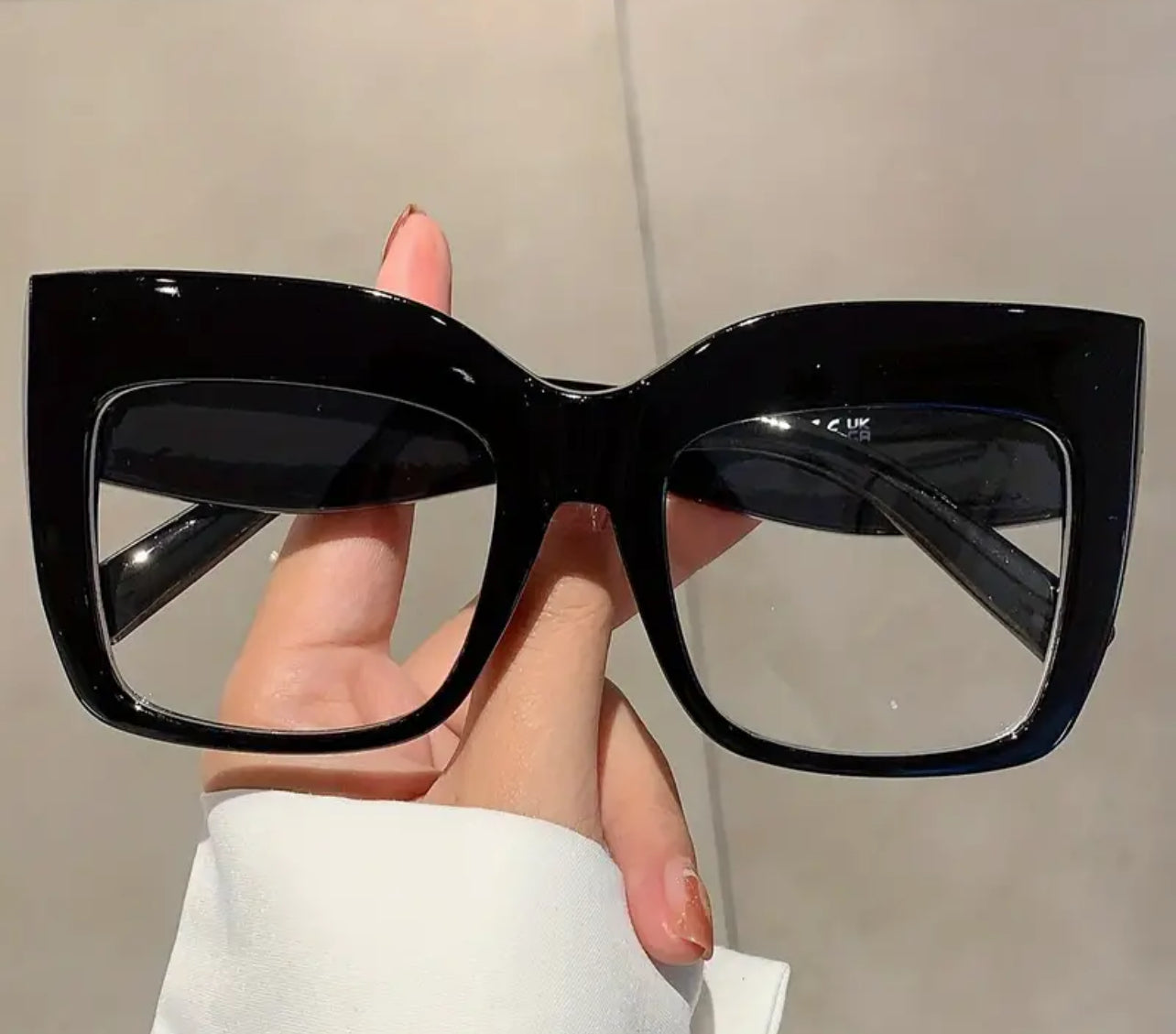 Oversized cat eye clear lens glasses.