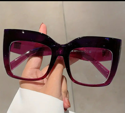 Oversized cat eye clear lens glasses.